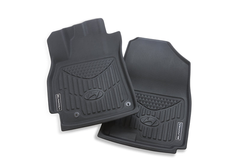 Pair of black Hyundai floor mats on a white background