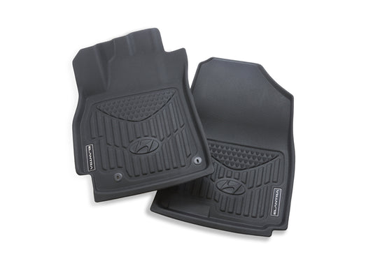 Pair of black Hyundai floor mats on a white background