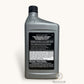 Gray bottle of engine oil with a black label on a white background